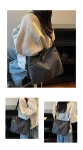 Detailed view of the casual plaid crossbody shoulder bag showing texture and strap design.
