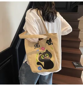 Joli sac cabas en toile chat noir sac a main bandouliere decontracte avec motif floral.
