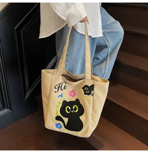 Détail du sac cabas en toile mignon avec impression de dessin animé de chat noir unique.