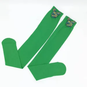 Calze verdi sopra il ginocchio natalizie con grazioso patch a tema cartone, collant lisci.