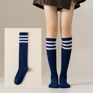 Detail view of Japanese style JK cosplay knee high socks featuring classic three stripes design.