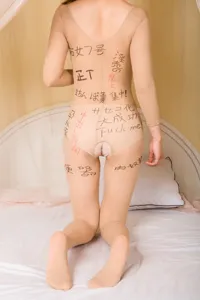 Sexy open crotch erotic pantyhose bodysuit with printed Japanese and English text for adult wear.