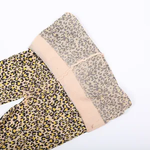Close-up detail shot of women's sexy leopard print pantyhose featuring an elastic waistband.