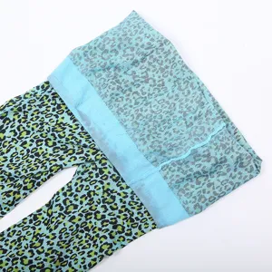 Blue leopard print pantyhose detail showing the soft fabric and elastic waistband close up.