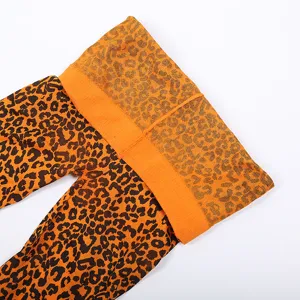 Sexy orange leopard print pantyhose tights for women, stretchy waist design, ideal for parties.