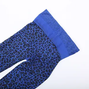 Close-up detail of blue leopard print pantyhose, featuring high waist elastic band and soft fabric.