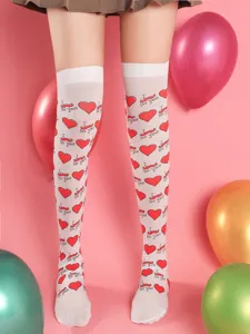 Detail view of white over-the-knee stockings with red heart and mustache prints for dating.