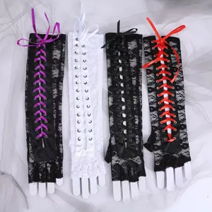 Close-up detail of gothic lace fingerless gloves with colorful ribbon lacing and metal eyelets.