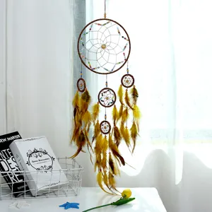 Handmade feather dreamcatcher with five rings, elegant hanging ornament for home decor and gifts.
