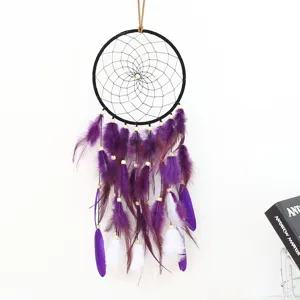 Handmade dream catcher with purple and white feathers, perfect for home wall decor and gifts.