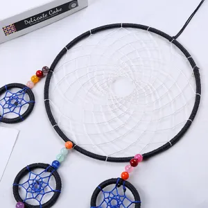 Handmade dream catcher wall hanging ornament with colorful beads and woven web for home decor.