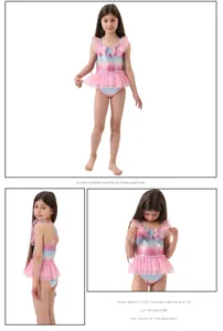 Bellissimo costume da bagno sirena bambina con stampa squame e gonna tutu arcobaleno.