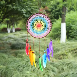 Handmade colorful dream catcher with vibrant feathers, boho style wall hanging decor for room.