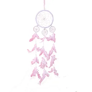 Pink handmade dream catcher wall hanging decor with feathers and rings for bedroom home decoration.