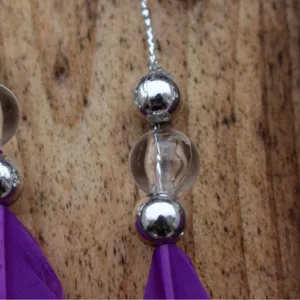 Handmade purple feather car hanging ornament with silver and clear beads for auto decor.