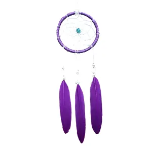 Handcrafted purple dream catcher wall hanging with feathers, perfect for car or home decor.