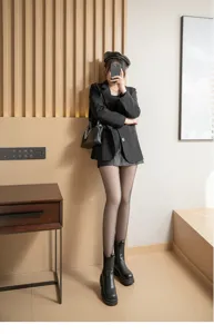 Detail view of fleece-lined translucent fake sheer winter tights worn by a stylish model.