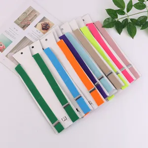 Detailed view of colorful solid suspenders for adults, elastic braces with metal clips shown clearly.