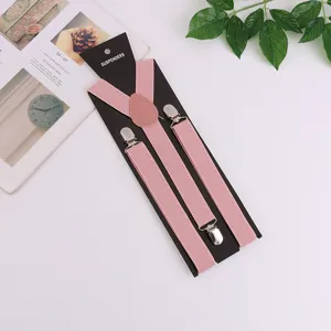 Adult pink elastic Y-back suspenders with metal clips and cardboard packaging for daily wear.