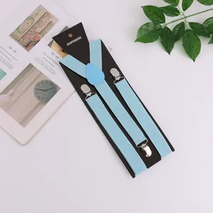 Light blue elastic suspenders with three metal clips and black display backing card for adults.