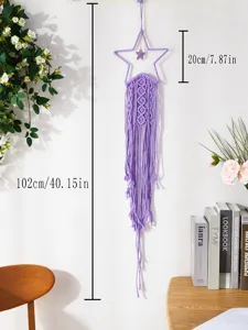 Macrame star wall hanging detail showing handmade purple cotton rope texture and dimensions.