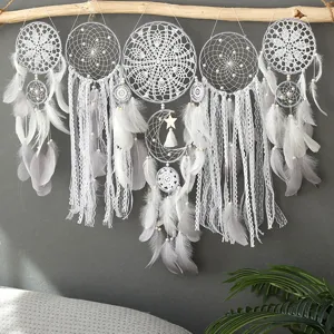 Handcrafted white dream catcher wall hanging with feathers, lace tassels, and wooden beads.