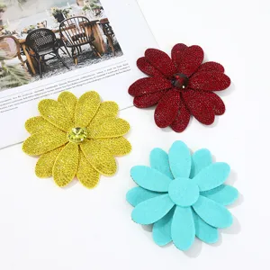 Detailed view of dazzling rhinestone flower patches and sparkling crystal brooches for DIY fashion.