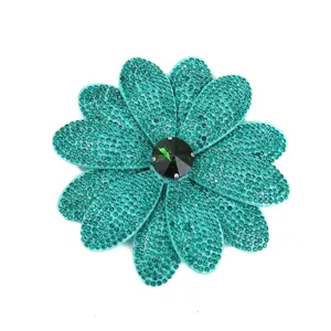 Detailed view of sparkling green rhinestone flower brooch shoe patch DIY fashion accessory.