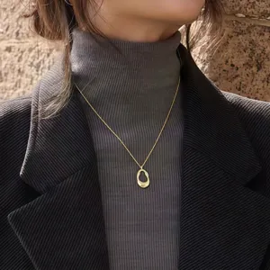 Elegant minimalist gold pendant necklace for women, stylish sweater chain jewelry accessory.