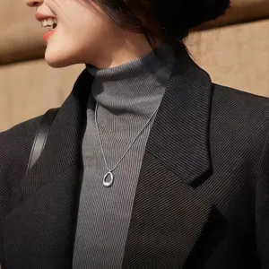 Elegant minimalist silver pendant necklace for women, perfect autumn winter sweater accessory.
