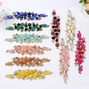 Detailed view of colorful 3D beaded flower lace patches for DIY apparel wedding dress decor.