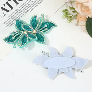Crystal rhinestone orchid patch detail shot, beautiful DIY clothing accessory for fashion decoration.