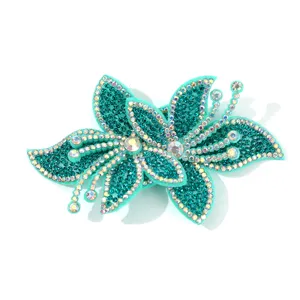 Exquisite teal rhinestone orchid fabric patch DIY apparel accessory for high-end fashion design.