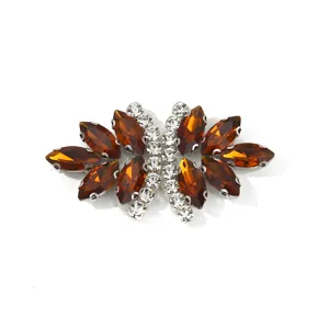 Exquisite brown and clear rhinestone bow apparel accessory close-up detail for DIY clothing shoes.