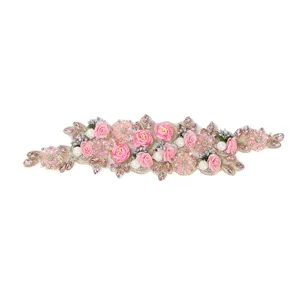 Close-up detail of 3D pink floral beaded embroidery lace patch, perfect for DIY dress decor.