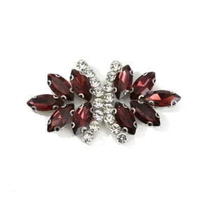 Detailed view of rhinestone butterfly applique, dark red and clear glass crystals for apparel.