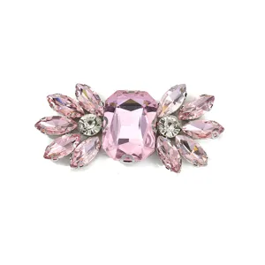 Detailed close-up of a sparkling pink crystal rhinestone shoe buckle DIY garment accessory.