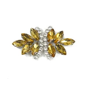Detailed view of the sparkling yellow rhinestone bow crystal patch for apparel decoration.