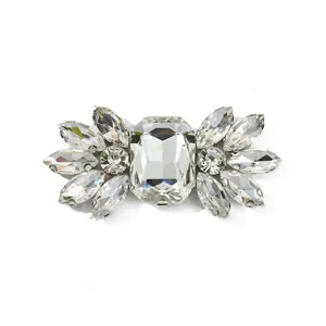 Close-up detail of crystal rhinestone decorative shoe buckle, sparkling glass gems for DIY craft.