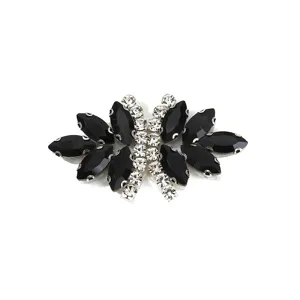 Rhinestone bow patch detail, sparkling black and clear glass crystals for clothing shoes.