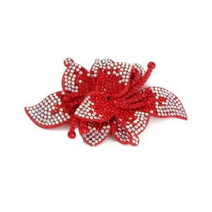Detailed close-up of a sparkling red rhinestone flower patch, perfect DIY shoe accessory.