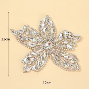 Detailed view of the silver rhinestone flower patch, sparkly crystal DIY clothing accessory.