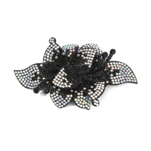 Sparkling rhinestone flower patch detail, crystal shoe buckle accessory for DIY crafts.