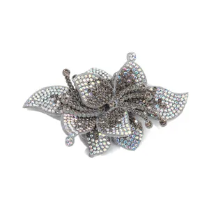 Sparkling rhinestone floral shoe buckle patch fabric accessory for footwear decoration.