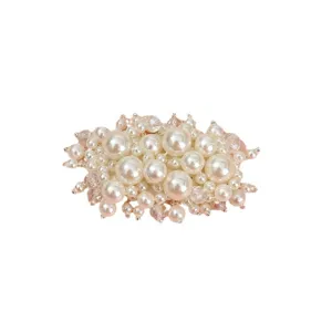 Handmade pearl cluster hair clip or decorative accessory featuring elegant white pearls and beads.