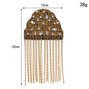 Detail view of vintage beaded tassel shoulder epaulet with sparkling rhinestones and chains.