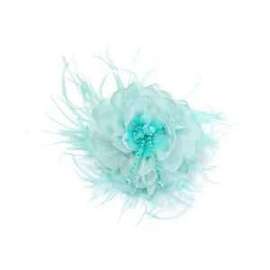 Mint green fabric flower brooch with feathers and rhinestone beads for DIY apparel accessories.