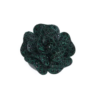 Dark green rhinestone camellia flower accessory detail view, sparkling DIY clothing patch.