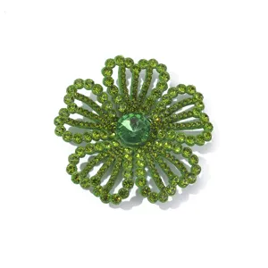 Detailgezicht van groene strass-bloemapplicatie, fonkelende kristalversieringen voor knutselen.