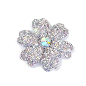 Rhinestone flower close-up detail, sparkling crystal embellishment for DIY apparel accessories.
